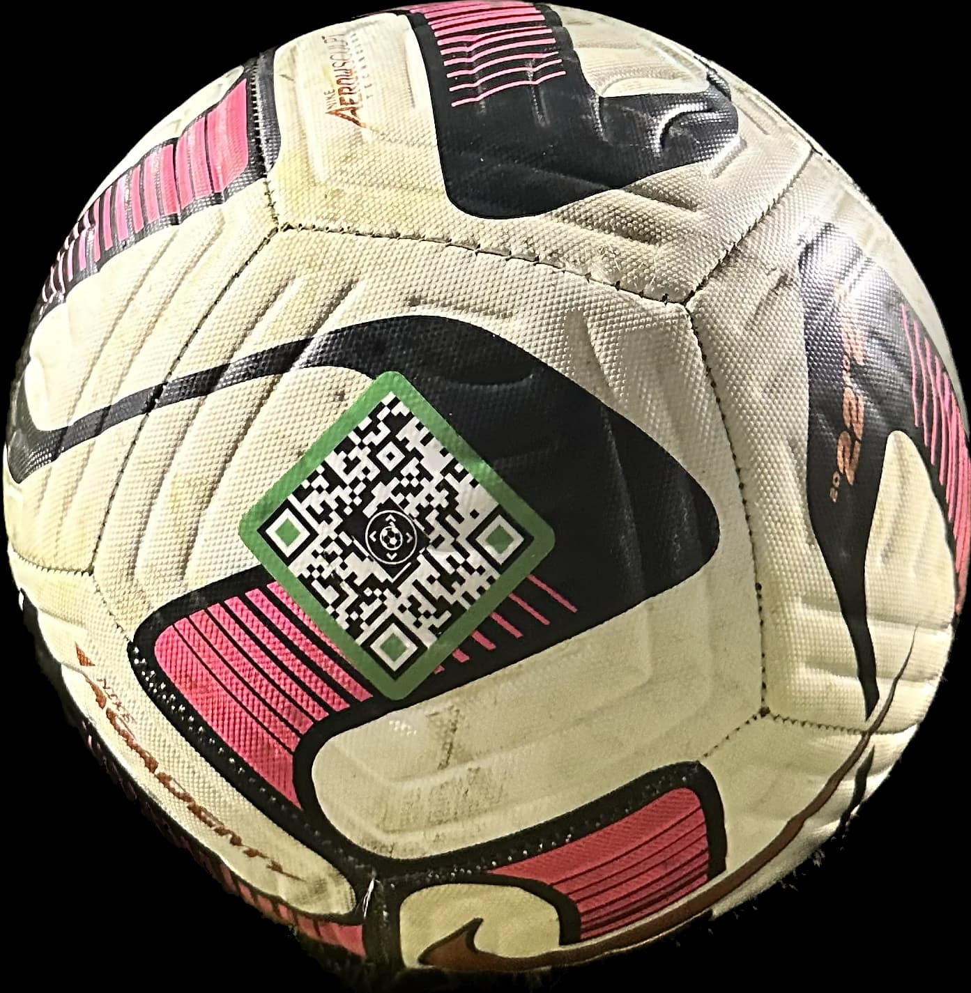 The full QR pattern of a SoccQR tag on a white and pink soccer ball