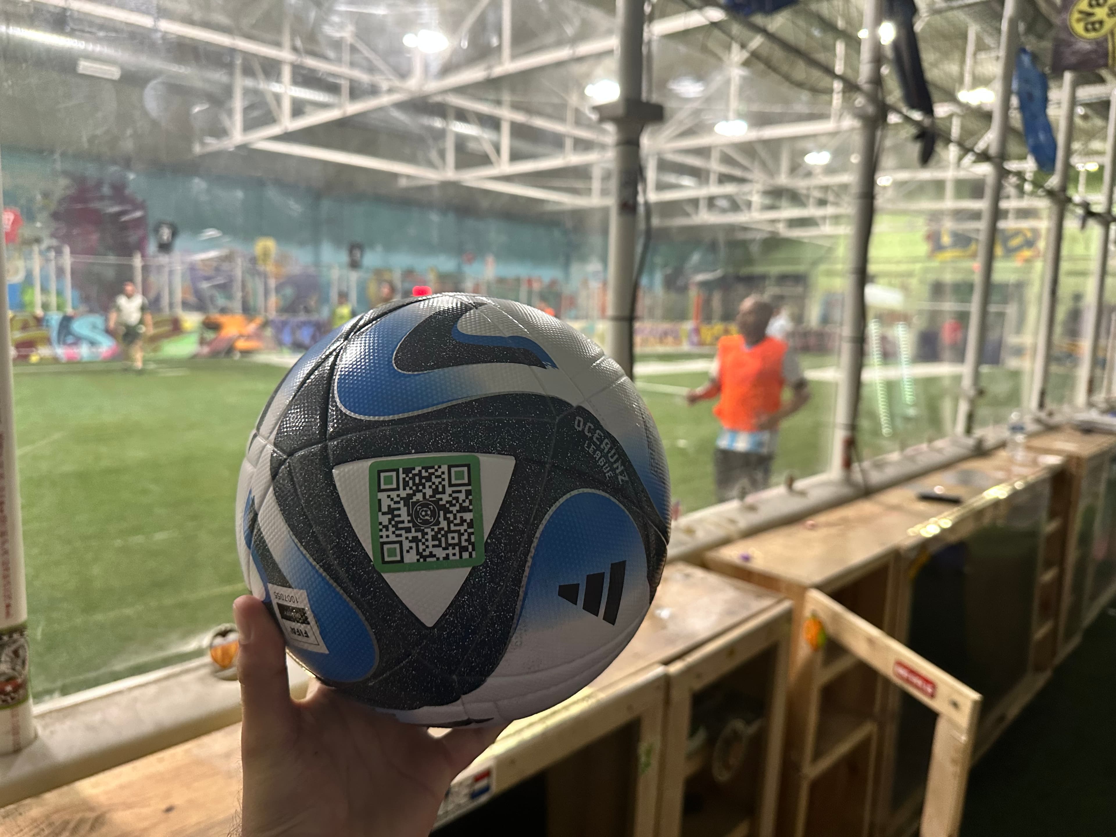 Applying a SoccQR tag to a soccer ball